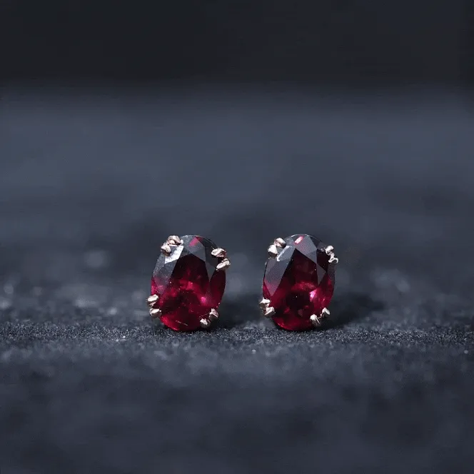Oval Cut Rhodolite Solitaire Stud Earrings in Double Claw Setting