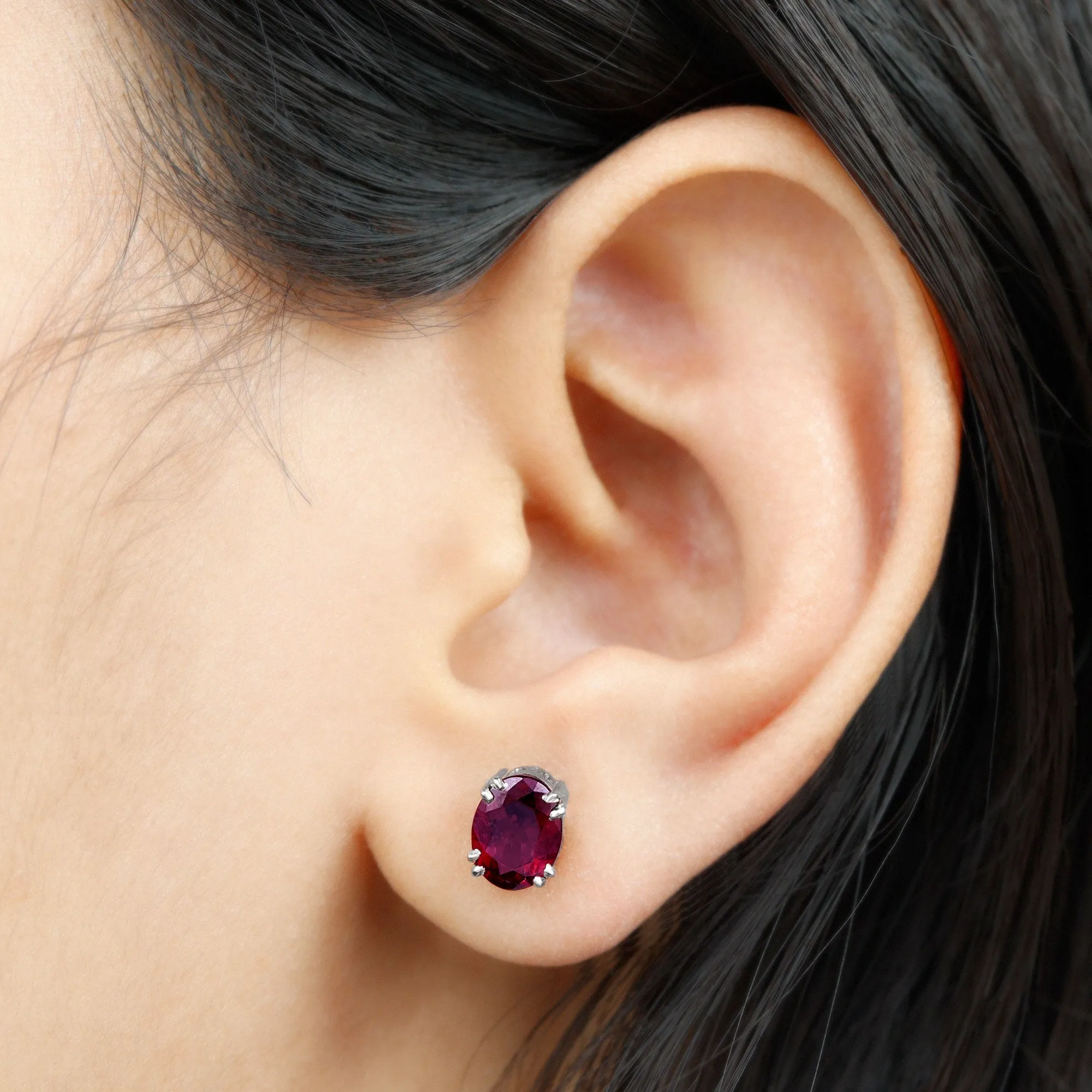 Oval Cut Rhodolite Solitaire Stud Earrings in Double Claw Setting