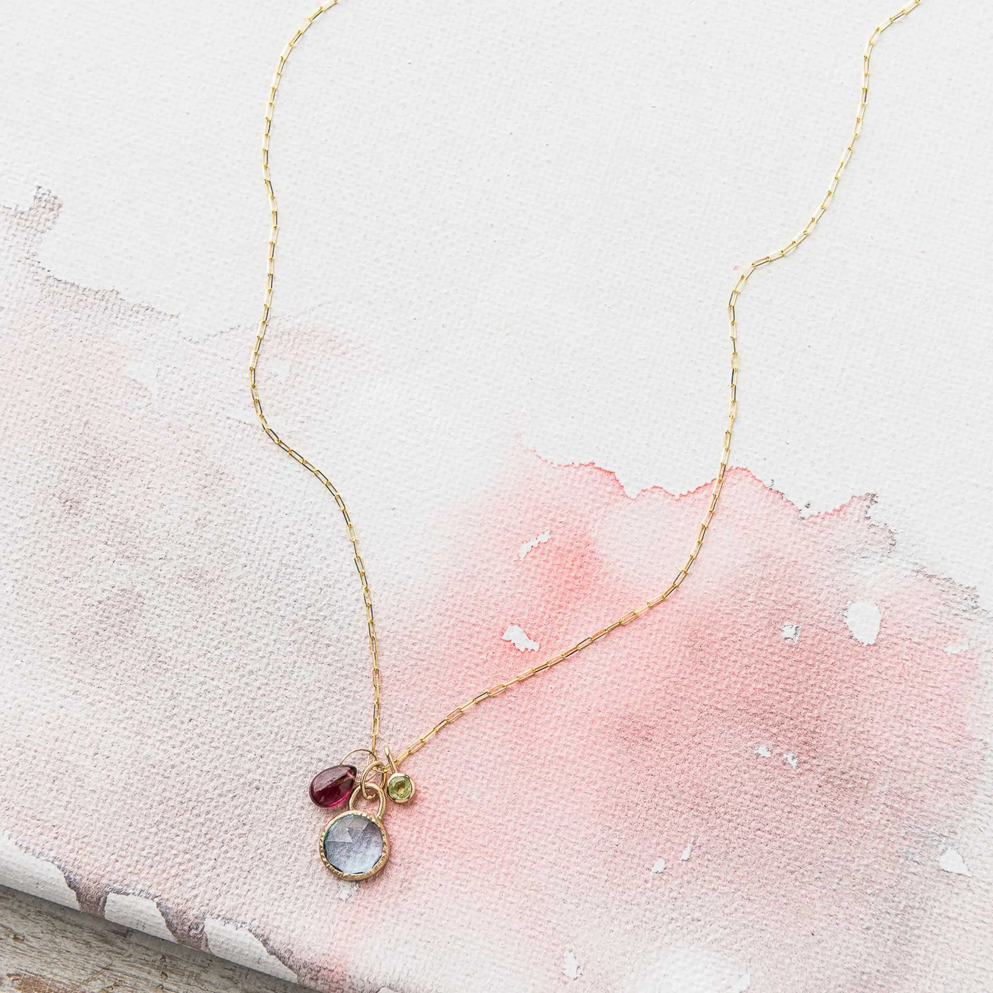 Sky Blue Topaz Necklace with Ruby and Peridot Charms