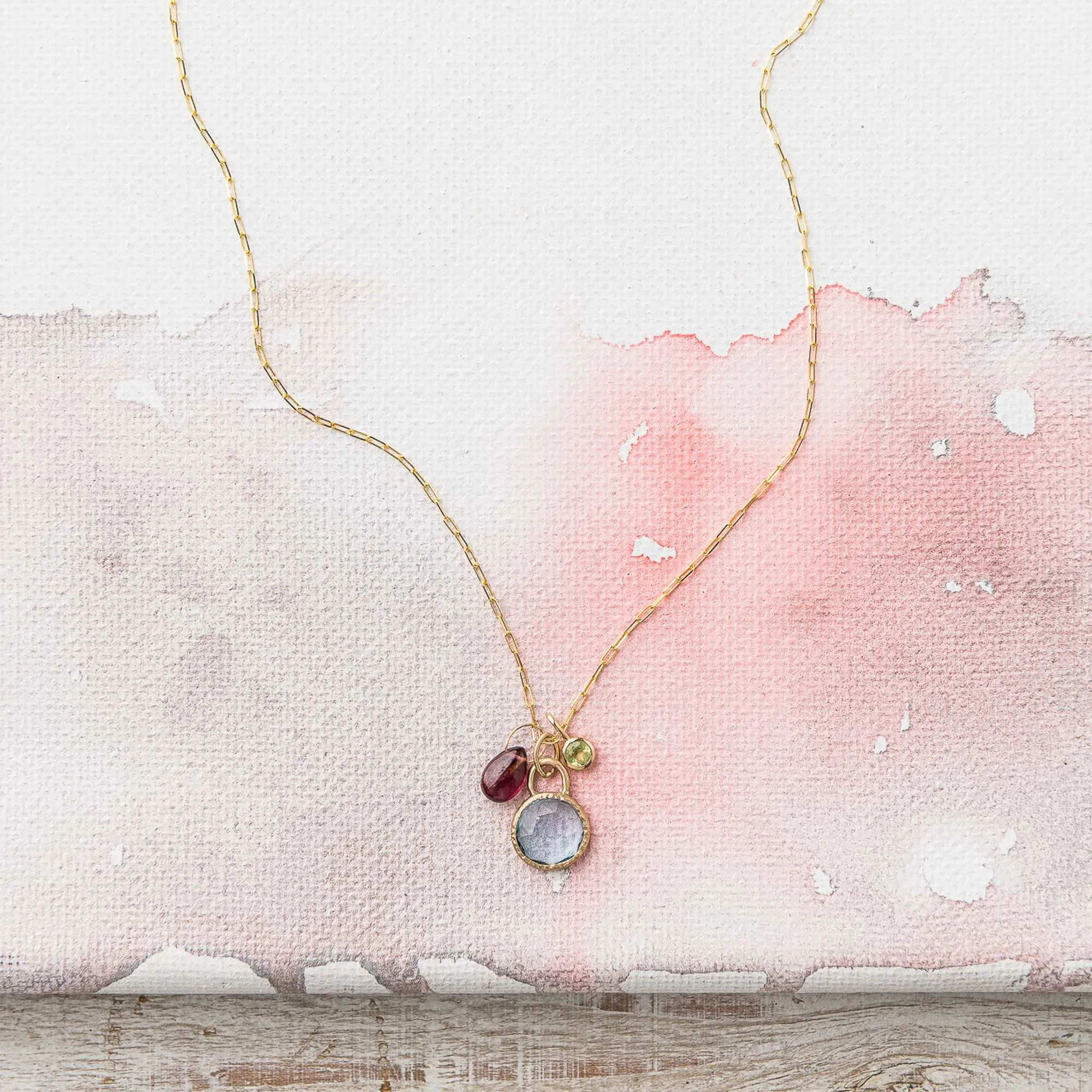 Sky Blue Topaz Necklace with Ruby and Peridot Charms
