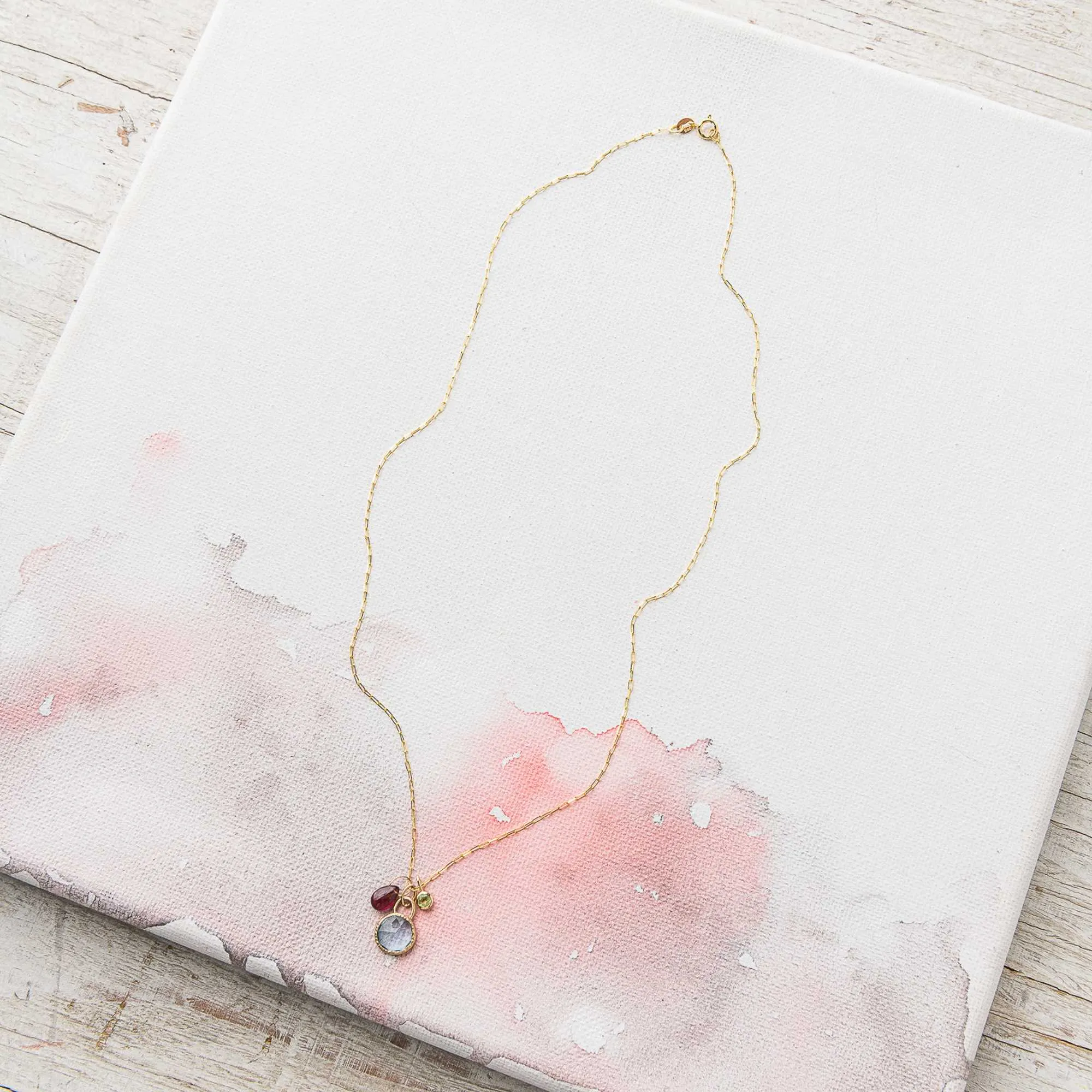 Sky Blue Topaz Necklace with Ruby and Peridot Charms